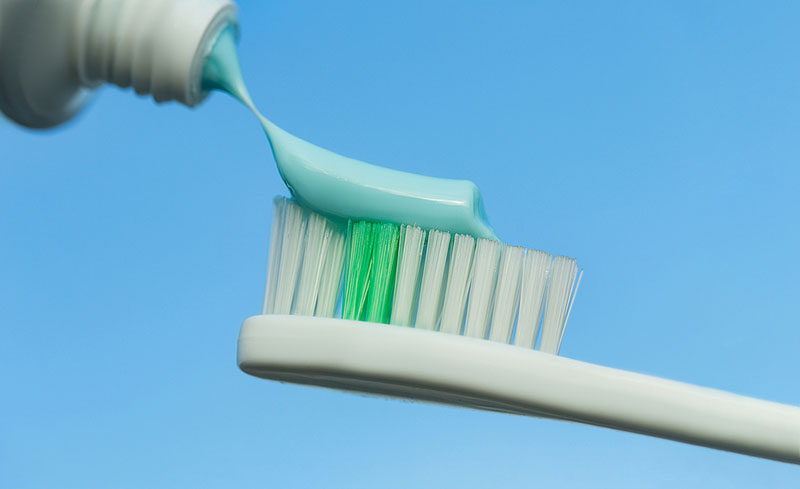 Toothpaste on a toothbrush.